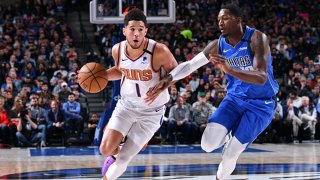 Devin Booker #1 of the Phoenix Suns drives to the basket against the Dallas Mavericks on Jan. 28, 2020 at the American Airlines Center in Dallas, Texas.