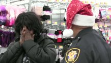 Kiondria Byner crying after being surprised by Fort Worth Police officers who paid for her Christmas.