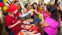 Firehouse-Theater-interacts-with-child-and-parent-at-NorthPark-Dallas-Donation-Station_photo-by-Kim-Leeson