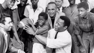 Frank Clarke (first row, center, in white shirt) seen in a 1968 photo of the opening of an East Dallas recreation center.