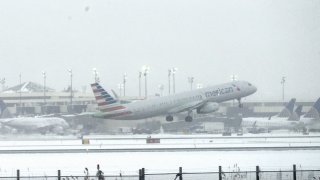 An American Airlines plane takes off from Newark International Airport