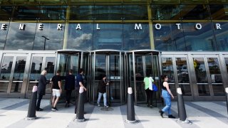 Visitors are seen at the General Motors world headquarters office in Detroit's Renaissance Center.