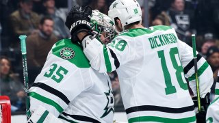 Anton Khudobin #35 of the Dallas Stars and Jason Dickinson #18 celebrate their win during the third period against the Los Angeles Kings at STAPLES Center on January 8, 2019 in Los Angeles, California.