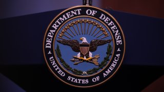 US Department of Defense logo is seen on the desk ahead of the press conference of U.S. Secretary of Defense, Mark Esper and Japanese Defense Minister Taro Kono in Washington, United States on January 14, 2020. (Photo by Yasin Ozturk/Anadolu Agency via Getty Images)