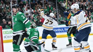 Curtis Lazar #27 and the Buffalo Sabres celebrate a goal against the Dallas Stars at the American Airlines Center on January 16, 2019 in Dallas, Texas.