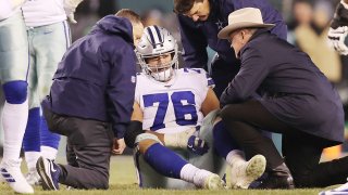 Xavier Su'a-Filo #76 of the Dallas Cowboys reacts after suffering an injury during the second half against the Philadelphia Eagles.