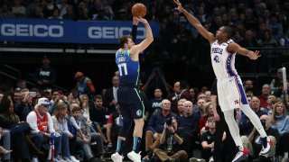 Luka Doncic #77 of the Dallas Mavericks takes a shot against Al Horford #42 of the Philadelphia 76ers at American Airlines Center on January 11, 2020 in Dallas.