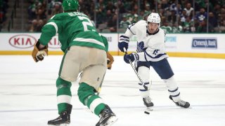 Alexander Kerfoot #15 of the Toronto Maple Leafs skates the puck against the Dallas Stars in the second period at American Airlines Center on January 29, 2020 in Dallas, Texas.
