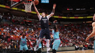 Luka Doncic #77 of the Dallas Mavericks shoots the ball against the Miami Heat on February 28, 2020 at American Airlines Arena in Miami, Florida.