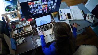 Lauryn Morley, a lower school substitute teacher for the Washington Waldorf School in Bethesda, Maryland, works from her home due to the Coronavirus outbreak, on April 1, 2020, in Arlington, Virginia.