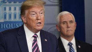 President Donald Trump speaks as Vice President Mike Pence listens during a news conference in the White House in Washington, D.C., on April 24, 2020.