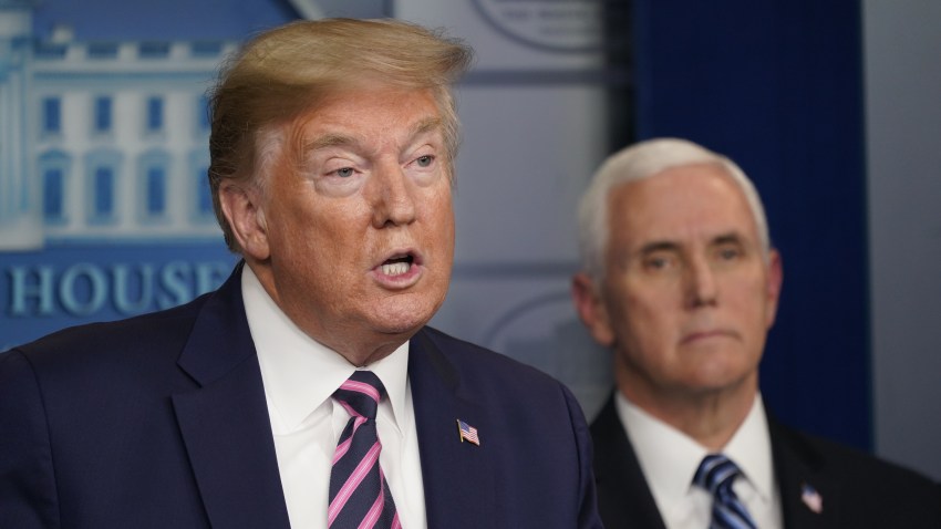 President Donald Trump speaks as Vice President Mike Pence listens during a news conference in the White House in Washington, D.C., U.S., on Friday, April 24, 2020.