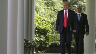 President Donald Trump and Vice President Mike Pence, right, arrive for a protecting seniors with diabetes event in the Rose Garden of the White House in Washington, D.C., U.S., on May 26, 2020.