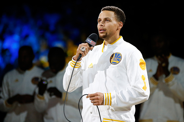 OAKLAND, CA - OCTOBER 27: Stephen Curry #30 of the Golden State Warriors addresses the crowd after recieving his championship ring prior to their game against the New Orleans Pelicans in the NBA season opener at ORACLE Arena on October 27, 2015 in Oakland, California. NOTE TO USER: User expressly acknowledges and agrees that, by downloading and or using this photograph, User is consenting to the terms and conditions of the Getty Images License Agreement. (Photo by Ezra Shaw/Getty Images)