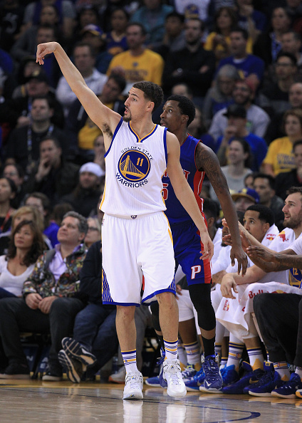 OAKLAND, CA - NOVEMBER 09: Klay Thompson #11 of the Golden State Warriors watches a three-point basket go in against the Detroit Pistons at ORACLE Arena on November 9, 2015 in Oakland, California. NOTE TO USER: User expressly acknowledges and agrees that, by downloading and or using this photograph, User is consenting to the terms and conditions of the Getty Images License Agreement. (Photo by Ezra Shaw/Getty Images)