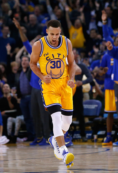 OAKLAND, CA - NOVEMBER 17: Stephen Curry #30 of the Golden State Warriors celebrates after he made a three-point basket against the Toronto Raptors at ORACLE Arena on November 17, 2015 in Oakland, California. NOTE TO USER: User expressly acknowledges and agrees that, by downloading and or using this photograph, User is consenting to the terms and conditions of the Getty Images License Agreement. (Photo by Ezra Shaw/Getty Images)