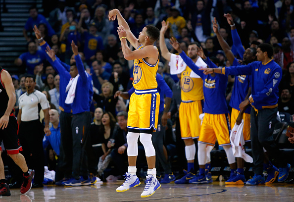 OAKLAND, CA - NOVEMBER 17: Stephen Curry #30 of the Golden State Warriors watches a three-point basket go in during their game against the Toronto Raptors at ORACLE Arena on November 17, 2015 in Oakland, California. NOTE TO USER: User expressly acknowledges and agrees that, by downloading and or using this photograph, User is consenting to the terms and conditions of the Getty Images License Agreement. (Photo by Ezra Shaw/Getty Images)