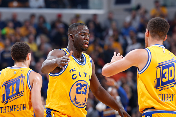 INDIANAPOLIS, IN - DECEMBER 8: Draymond Green #23 and Stephen Curry #30 of the Golden State Warriors celebrate against the Indiana Pacers in the first half of the game at Bankers Life Fieldhouse on December 8, 2015 in Indianapolis, Indiana. NOTE TO USER: User expressly acknowledges and agrees that, by downloading and or using the photograph, User is consenting to the terms and conditions of the Getty Images License Agreement. (Photo by Joe Robbins/Getty Images)
