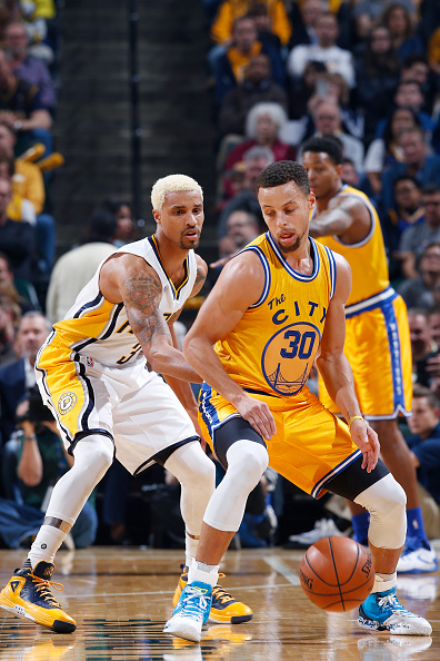 INDIANAPOLIS, IN - DECEMBER 8: Stephen Curry #30 of the Golden State Warriors handles the ball against George Hill #3 of the Indiana Pacers in the first half of the game at Bankers Life Fieldhouse on December 8, 2015 in Indianapolis, Indiana. NOTE TO USER: User expressly acknowledges and agrees that, by downloading and or using the photograph, User is consenting to the terms and conditions of the Getty Images License Agreement. (Photo by Joe Robbins/Getty Images)