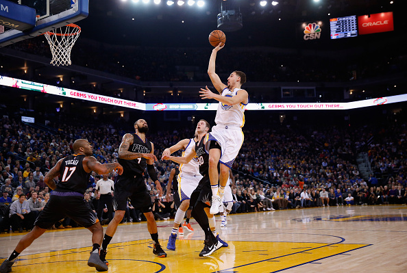 OAKLAND, CA - DECEMBER 16: Klay Thompson #11 of the Golden State Warriors shoots the ball during their game against the Phoenix Suns at ORACLE Arena on December 16, 2015 in Oakland, California. NOTE TO USER: User expressly acknowledges and agrees that, by downloading and or using this photograph, User is consenting to the terms and conditions of the Getty Images License Agreement. (Photo by Ezra Shaw/Getty Images)