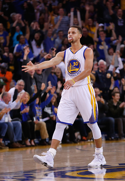 OAKLAND, CA - DECEMBER 28: Stephen Curry #30 of the Golden State Warriors reacts after he made a three-point basket against the Sacramento Kings at ORACLE Arena on December 28, 2015 in Oakland, California. NOTE TO USER: User expressly acknowledges and agrees that, by downloading and or using this photograph, User is consenting to the terms and conditions of the Getty Images License Agreement. (Photo by Ezra Shaw/Getty Images)