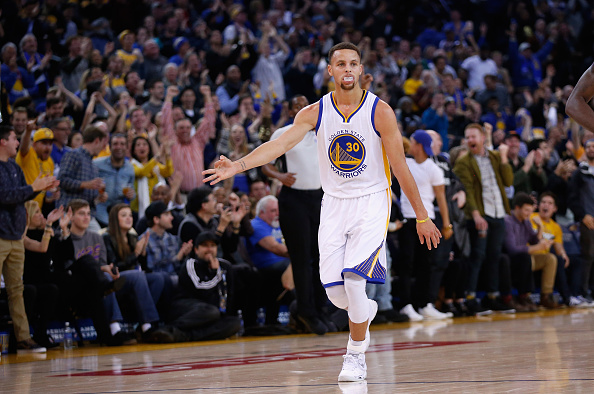 OAKLAND, CA - DECEMBER 28: Stephen Curry #30 of the Golden State Warriors reacts after he made a three-point basket against the Sacramento Kings at ORACLE Arena on December 28, 2015 in Oakland, California. NOTE TO USER: User expressly acknowledges and agrees that, by downloading and or using this photograph, User is consenting to the terms and conditions of the Getty Images License Agreement. (Photo by Ezra Shaw/Getty Images)
