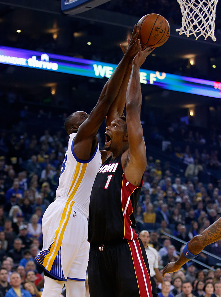OAKLAND, CA - JANUARY 11: Chris Bosh #1 of the Miami Heat and Draymond Green #23 of the Golden State Warriors go for a rebound at ORACLE Arena on January 11, 2016 in Oakland, California. NOTE TO USER: User expressly acknowledges and agrees that, by downloading and or using this photograph, User is consenting to the terms and conditions of the Getty Images License Agreement. (Photo by Ezra Shaw/Getty Images)