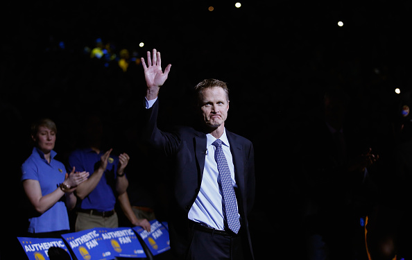 OAKLAND, CA - JANUARY 22: Head coach Steve Kerr of the Golden State Warriors waves to the crowd before their game against the Indiana Pacers at ORACLE Arena on January 22, 2016 in Oakland, California. This is Kerr's first game of the season. NOTE TO USER: User expressly acknowledges and agrees that, by downloading and or using this photograph, User is consenting to the terms and conditions of the Getty Images License Agreement. (Photo by Ezra Shaw/Getty Images)