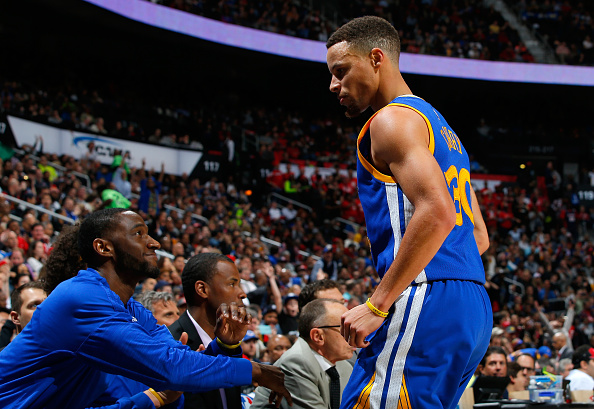 ATLANTA, GA - FEBRUARY 22: Stephen Curry #30 of the Golden State Warriors reacts towards his bench after hitting a three-point basket against Jeff Teague #0 of the Atlanta Hawks at Philips Arena on February 22, 2016 in Atlanta, Georgia. NOTE TO USER User expressly acknowledges and agrees that, by downloading and or using this photograph, user is consenting to the terms and conditions of the Getty Images License Agreement. (Photo by Kevin C. Cox/Getty Images)