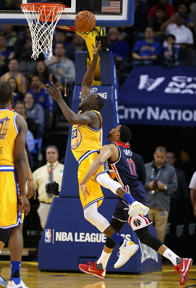 OAKLAND, CA - MARCH 29: Draymond Green #23 of the Golden State Warriors is fouled by Garrett Temple #17 of the Washington Wizards at ORACLE Arena on March 29, 2016 in Oakland, California. NOTE TO USER: User expressly acknowledges and agrees that, by downloading and or using this photograph, User is consenting to the terms and conditions of the Getty Images License Agreement. (Photo by Ezra Shaw/Getty Images)