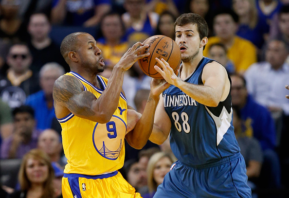 OAKLAND, CA - APRIL 05: Andre Iguodala #9 of the Golden State Warriors and Nemanja Bjelica #88 of the Minnesota Timberwolves go for a loose ball at ORACLE Arena on April 5, 2016 in Oakland, California. NOTE TO USER: User expressly acknowledges and agrees that, by downloading and or using this photograph, User is consenting to the terms and conditions of the Getty Images License Agreement. (Photo by Ezra Shaw/Getty Images)