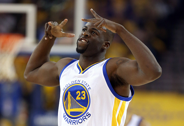 OAKLAND, CA - APRIL 27: Draymond Green #23 of the Golden State Warriors reacts after making a three-point basket against the Houston Rockets in Game Five of the Western Conference Quarterfinals during the 2016 NBA Playoffs at ORACLE Arena on April 27, 2016 in Oakland, California. NOTE TO USER: User expressly acknowledges and agrees that, by downloading and or using this photograph, user is consenting to the terms and conditions of Getty Images License Agreement. (Photo by Ezra Shaw/Getty Images)