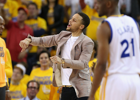 OAKLAND, CA - APRIL 27: Injured Stephen Curry #30 of the Golden State Warriors reacts on the bench during their game against the Houston Rockets in Game Five of the Western Conference Quarterfinals during the 2016 NBA Playoffs at ORACLE Arena on April 27, 2016 in Oakland, California. NOTE TO USER: User expressly acknowledges and agrees that, by downloading and or using this photograph, user is consenting to the terms and conditions of Getty Images License Agreement. (Photo by Ezra Shaw/Getty Images)