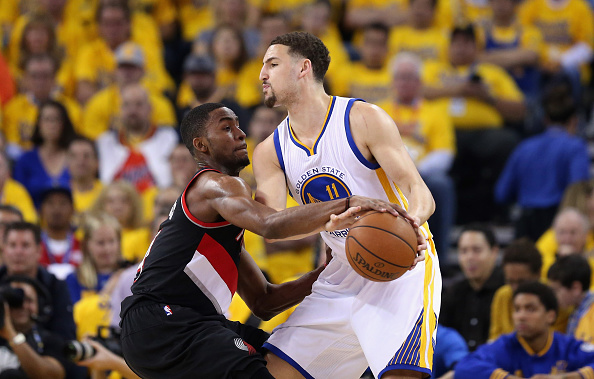 OAKLAND, CA - MAY 03: Klay Thompson #11 of the Golden State Warriors is guarded by Maurice Harkless #4 of the Portland Trail Blazers during Game Two of the Western Conference Semifinals during the 2016 NBA Playoffs on May 3, 2016 at Oracle Arena in Oakland, California. NOTE TO USER: User expressly acknowledges and agrees that, by downloading and or using this photograph, User is consenting to the terms and conditions of the Getty Images License Agreement. (Photo by Ezra Shaw/Getty Images)