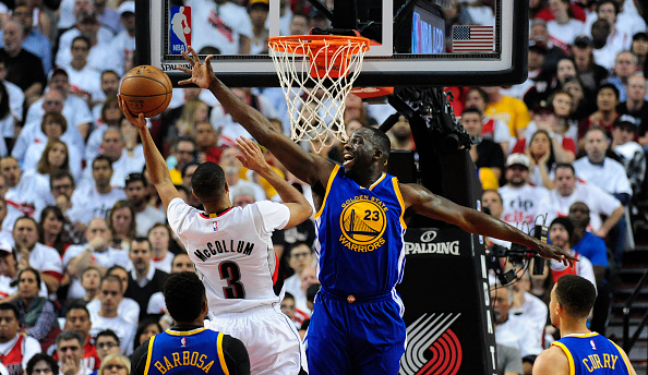 PORTLAND, OR - MAY 9: C.J. McCollum #3 of the Portland Trail Blazers drives to the basket on Draymond Green #23 of the Golden State Warriors during the first quarter of Game Four of the Western Conference Semifinals during the 2016 NBA Playoffs at the Moda Center on May 9, 2016 in Portland, Oregon. NOTE TO USER: User expressly acknowledges and agrees that by downloading and/or using this photograph, user is consenting to the terms and conditions of the Getty Images License Agreement. (Photo by Steve Dykes/Getty Images)