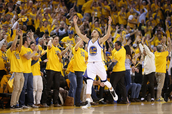 OAKLAND, CA - MAY 11: Stephen Curry #30 of the Golden State Warriors reacts after making a three-point basket in the first quarter against the Portland Trail Blazers during Game Five of the Western Conference Semifinals during the 2016 NBA Playoffs on May 11, 2016 at Oracle Arena in Oakland, California. NOTE TO USER: User expressly acknowledges and agrees that, by downloading and or using this photograph, User is consenting to the terms and conditions of the Getty Images License Agreement. (Photo by Ezra Shaw/Getty Images)