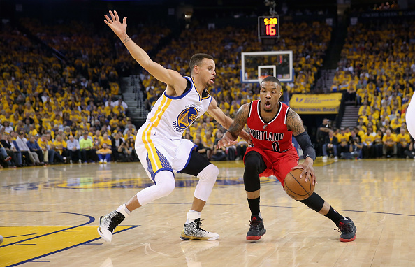 OAKLAND, CA - MAY 11: Damian Lillard #0 of the Portland Trail Blazers is guarded by Stephen Curry #30 of the Golden State Warriors during Game Five of the Western Conference Semifinals during the 2016 NBA Playoffs on May 11, 2016 at Oracle Arena in Oakland, California. NOTE TO USER: User expressly acknowledges and agrees that, by downloading and or using this photograph, User is consenting to the terms and conditions of the Getty Images License Agreement. (Photo by Ezra Shaw/Getty Images)