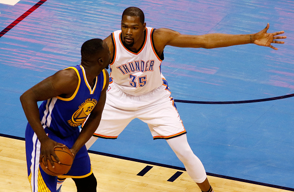 OKLAHOMA CITY, OK - MAY 22: Draymond Green #23 of the Golden State Warriors drives against Kevin Durant #35 of the Oklahoma City Thunder in the first quater in game three of the Western Conference Finals during the 2016 NBA Playoffs at Chesapeake Energy Arena on May 22, 2016 in Oklahoma City, Oklahoma. NOTE TO USER: User expressly acknowledges and agrees that, by downloading and or using this photograph, User is consenting to the terms and conditions of the Getty Images License Agreement. (Photo by J Pat Carter/Getty Images)