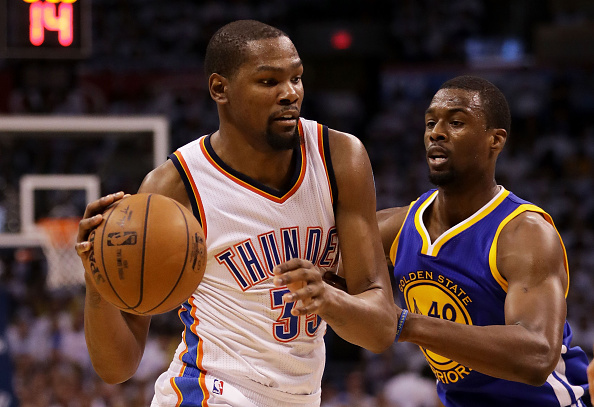 OKLAHOMA CITY, OK - MAY 24: Kevin Durant #35 of the Oklahoma City Thunder drives against Harrison Barnes #40 of the Golden State Warriors in the third quarter in game four of the Western Conference Finals during the 2016 NBA Playoffs at Chesapeake Energy Arena on May 24, 2016 in Oklahoma City, Oklahoma. NOTE TO USER: User expressly acknowledges and agrees that, by downloading and or using this photograph, User is consenting to the terms and conditions of the Getty Images License Agreement. (Photo by Ronald Martinez/Getty Images)