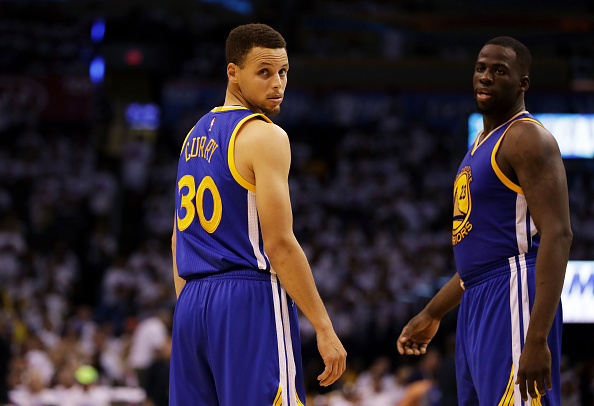 OKLAHOMA CITY, OK - MAY 24: Stephen Curry #30 and Draymond Green #23 of the Golden State Warriors react in the third quarter against the Oklahoma City Thunder in game four of the Western Conference Finals during the 2016 NBA Playoffs at Chesapeake Energy Arena on May 24, 2016 in Oklahoma City, Oklahoma. NOTE TO USER: User expressly acknowledges and agrees that, by downloading and or using this photograph, User is consenting to the terms and conditions of the Getty Images License Agreement. (Photo by Ronald Martinez/Getty Images)