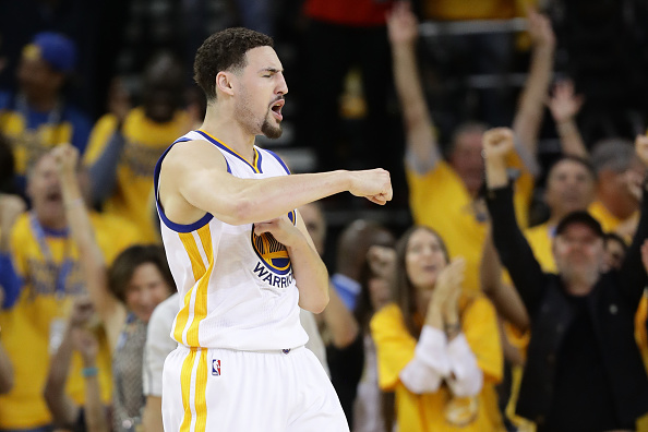 OAKLAND, CA - MAY 30: Klay Thompson #11 of the Golden State Warriorsreacts after a three-point basket against the Oklahoma City Thunder in Game Seven of the Western Conference Finals during the 2016 NBA Playoffs at ORACLE Arena on May 30, 2016 in Oakland, California. NOTE TO USER: User expressly acknowledges and agrees that, by downloading and or using this photograph, User is consenting to the terms and conditions of the Getty Images License Agreement. (Photo by Ezra Shaw/Getty Images)