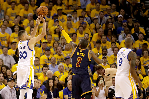 OAKLAND, CA - JUNE 02: Stephen Curry #30 of the Golden State Warriors shoots a three pointer over Kyrie Irving #2 of the Cleveland Cavaliers in Game 1 of the 2016 NBA Finals at ORACLE Arena on June 2, 2016 in Oakland, California. NOTE TO USER: User expressly acknowledges and agrees that, by downloading and or using this photograph, User is consenting to the terms and conditions of the Getty Images License Agreement. (Photo by Ezra Shaw/Getty Images)