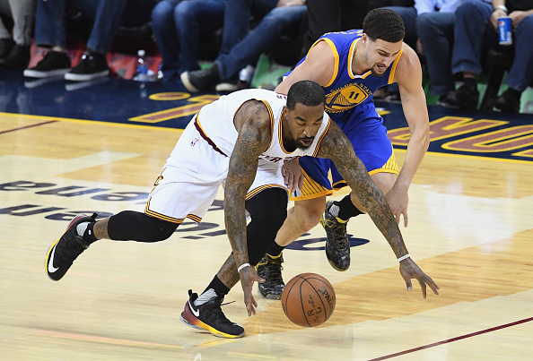 CLEVELAND, OH - JUNE 08: J.R. Smith #5 of the Cleveland Cavaliers and Klay Thompson #11 of the Golden State Warriors dive after a loose ball during the first half in Game 3 of the 2016 NBA Finals at Quicken Loans Arena on June 8, 2016 in Cleveland, Ohio. NOTE TO USER: User expressly acknowledges and agrees that, by downloading and or using this photograph, User is consenting to the terms and conditions of the Getty Images License Agreement. (Photo by Jason Miller/Getty Images)