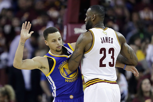 CLEVELAND, OH - JUNE 08: Stephen Curry #30 of the Golden State Warriors gets tangled with LeBron James #23 of the Cleveland Cavaliers during the first half in Game 3 of the 2016 NBA Finals at Quicken Loans Arena on June 8, 2016 in Cleveland, Ohio. NOTE TO USER: User expressly acknowledges and agrees that, by downloading and or using this photograph, User is consenting to the terms and conditions of the Getty Images License Agreement. (Photo by Ronald Martinez/Getty Images)