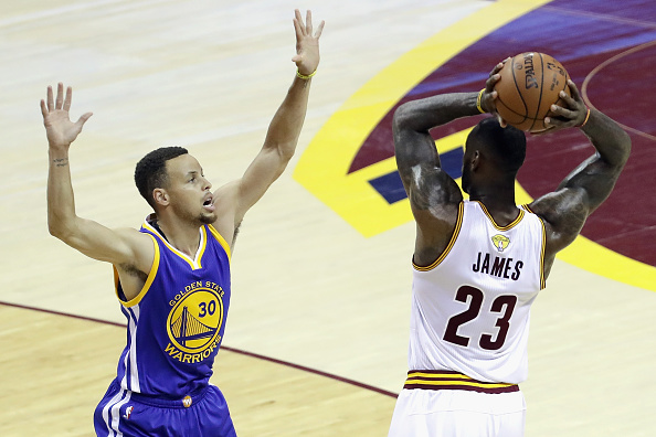 CLEVELAND, OH - JUNE 10: LeBron James #23 of the Cleveland Cavaliers handles the ball against Stephen Curry #30 of the Golden State Warriors during the first half in Game 4 of the 2016 NBA Finals at Quicken Loans Arena on June 10, 2016 in Cleveland, Ohio. NOTE TO USER: User expressly acknowledges and agrees that, by downloading and or using this photograph, User is consenting to the terms and conditions of the Getty Images License Agreement. (Photo by Ronald Martinez/Getty Images)