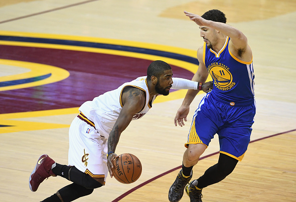 CLEVELAND, OH - JUNE 10: Kyrie Irving #2 of the Cleveland Cavaliers dribbles against Klay Thompson #11 of the Golden State Warriors during the first half in Game 4 of the 2016 NBA Finals at Quicken Loans Arena on June 10, 2016 in Cleveland, Ohio. NOTE TO USER: User expressly acknowledges and agrees that, by downloading and or using this photograph, User is consenting to the terms and conditions of the Getty Images License Agreement. (Photo by Jason Miller/Getty Images)