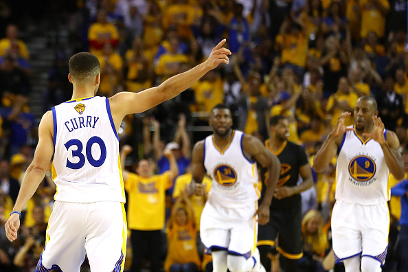 OAKLAND, CA - JUNE 13: Stephen Curry #30 of the Golden State Warriors reacts with Festus Ezeli #31 and Andre Iguodala #9 against the Cleveland Cavaliers during the second quarter in Game 5 of the 2016 NBA Finals at ORACLE Arena on June 13, 2016 in Oakland, California. NOTE TO USER: User expressly acknowledges and agrees that, by downloading and or using this photograph, User is consenting to the terms and conditions of the Getty Images License Agreement. (Photo by Ezra Shaw/Getty Images)