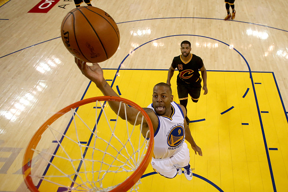 OAKLAND, CA - JUNE 13: Andre Iguodala #9 of the Golden State Warriors lays the ball up in the first half ahead of Tristan Thompson #13 of the Cleveland Cavaliers in Game 5 of the 2016 NBA Finals at ORACLE Arena on June 13, 2016 in Oakland, California. NOTE TO USER: User expressly acknowledges and agrees that, by downloading and or using this photograph, User is consenting to the terms and conditions of the Getty Images License Agreement. (Photo by Ezra Shaw/Getty Images)
