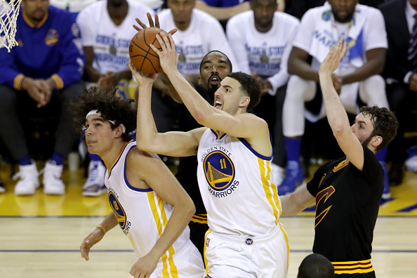 OAKLAND, CA - JUNE 19: Klay Thompson #11 of the Golden State Warriors takes a shot against the Cleveland Cavaliers in Game 7 of the 2016 NBA Finals at ORACLE Arena on June 19, 2016 in Oakland, California. NOTE TO USER: User expressly acknowledges and agrees that, by downloading and or using this photograph, User is consenting to the terms and conditions of the Getty Images License Agreement. (Photo by Ronald Martinez/Getty Images)