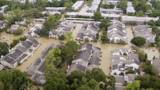 High view of flooded apartment buildings after Hurricane Harvey.